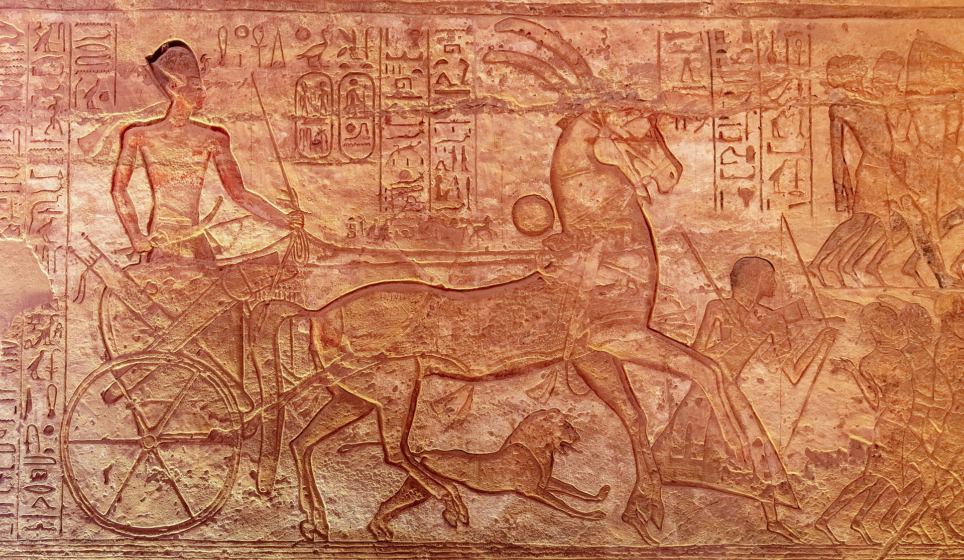 Carved facade of the great temple of Abu Simbel rising from the Lake Nasser shore